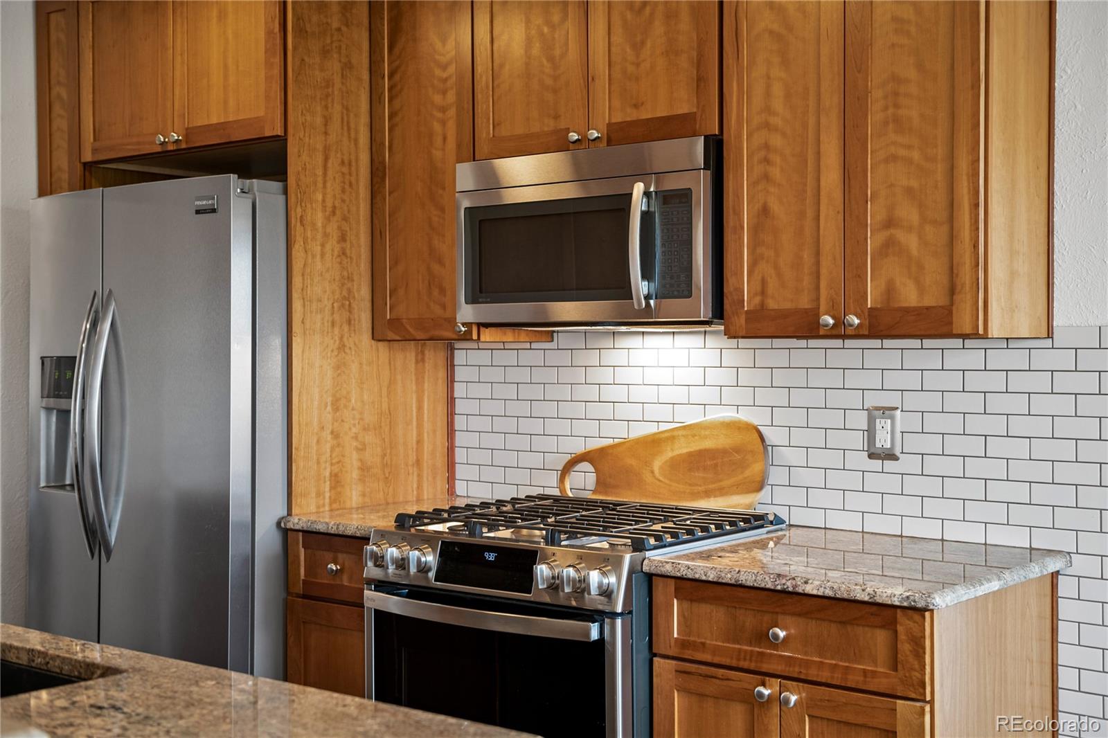 3385 Braun Road Golden, CO 80401 - Photo 12 of 40 a kitchen with granite countertop cabinets and steel stainless steel appliances