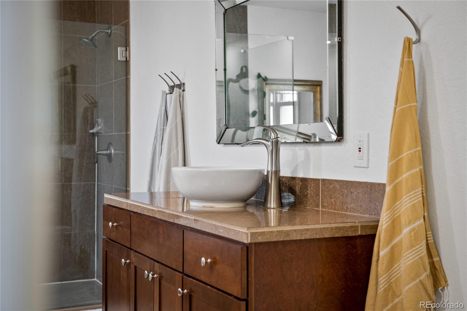 3385 Braun Road Golden, CO 80401 - Photo 18 of 40 a bathroom with a sink and mirror