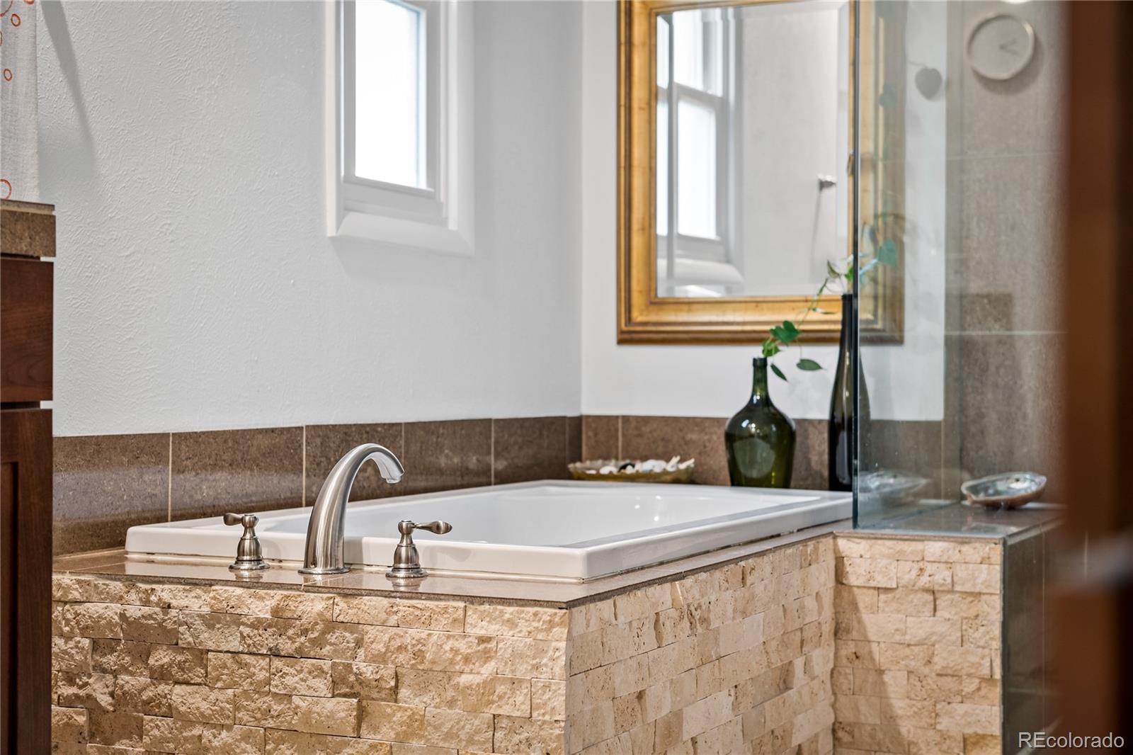 3385 Braun Road Golden, CO 80401 - Photo 19 of 40 a bathroom with mirror sink and window
