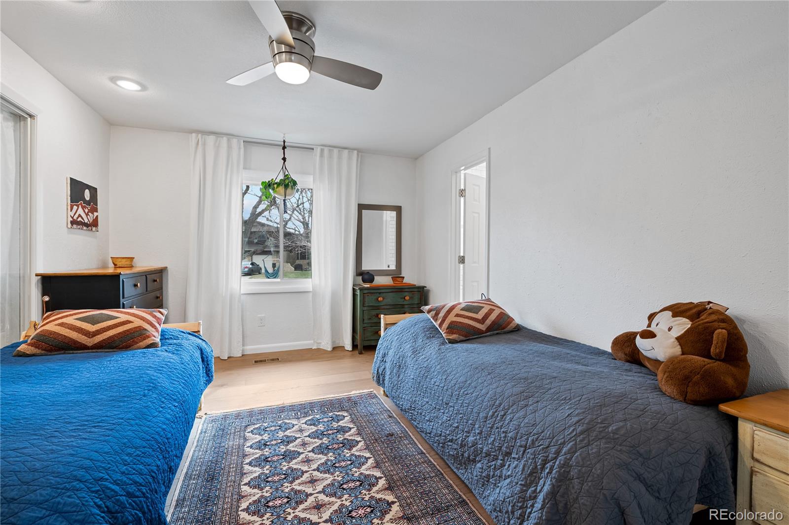 3385 Braun Road Golden, CO 80401 - Photo 23 of 40 a bedroom with furniture and a rug