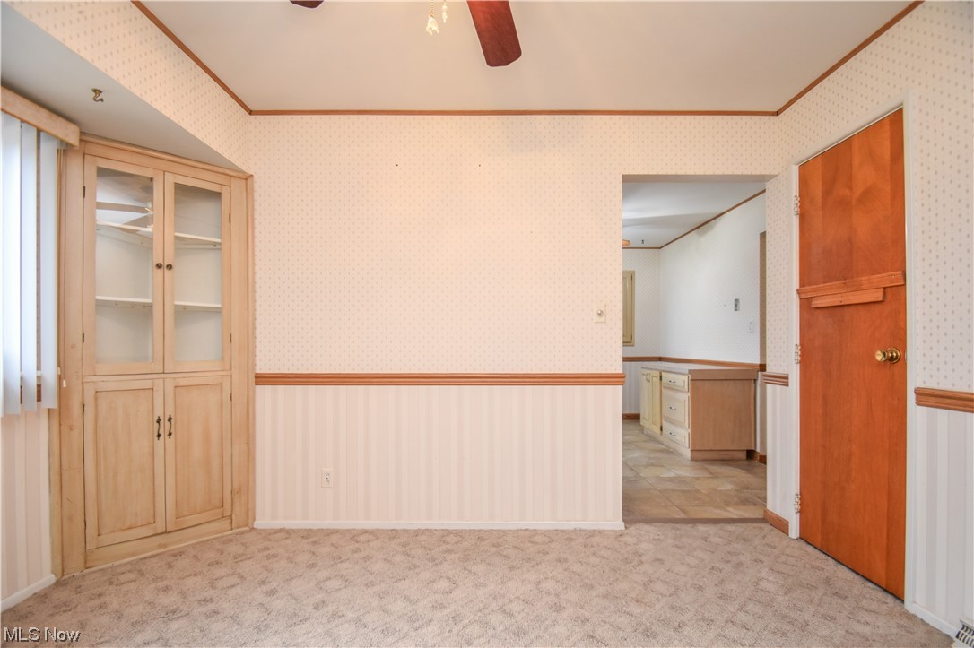 4606 Burkey Road Youngstown, OH 44515 - Photo 18 of 49 Unfurnished room with light carpet and ceiling fan