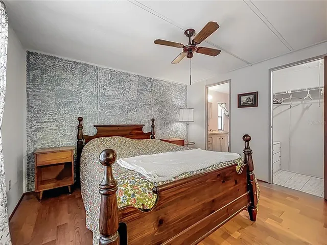 a bed room with a bed and a chandelier