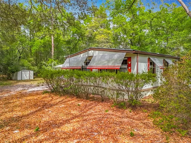 a backyard of a house with lots of green space