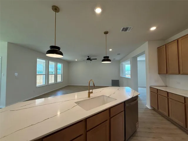 a kitchen with a sink and window