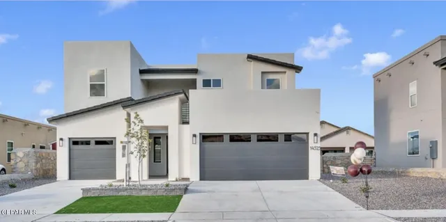 a front view of a house with yard