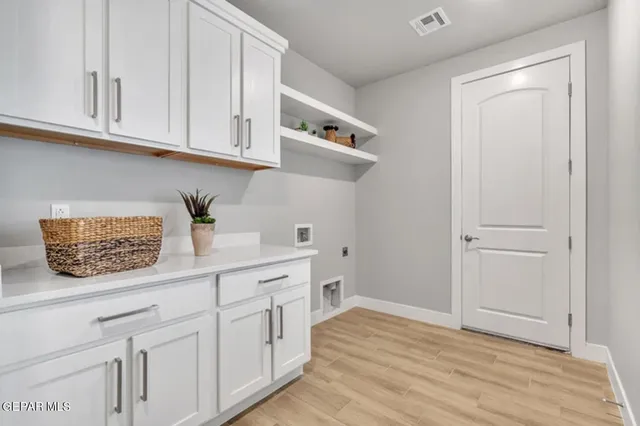 a kitchen with white cabinets