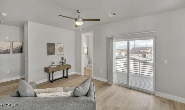 a bedroom with furniture and a window