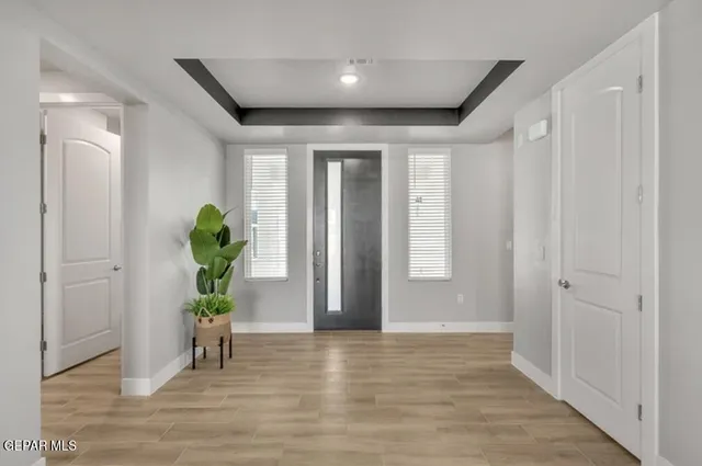 a view of hallway with wooden floor