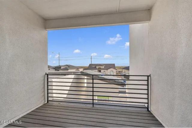 a view of a hallway with a chair