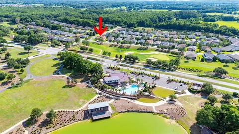 an aerial view of a house with a swimming pool yard and outdoor seating