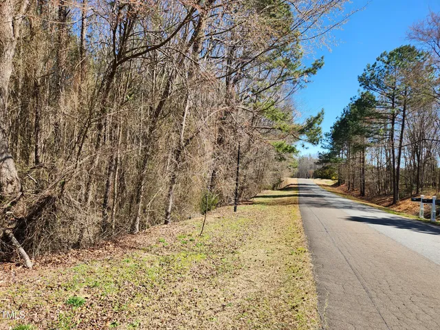 a view of swimming pool with sitting area