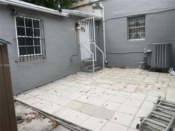 a view of a backyard of the house