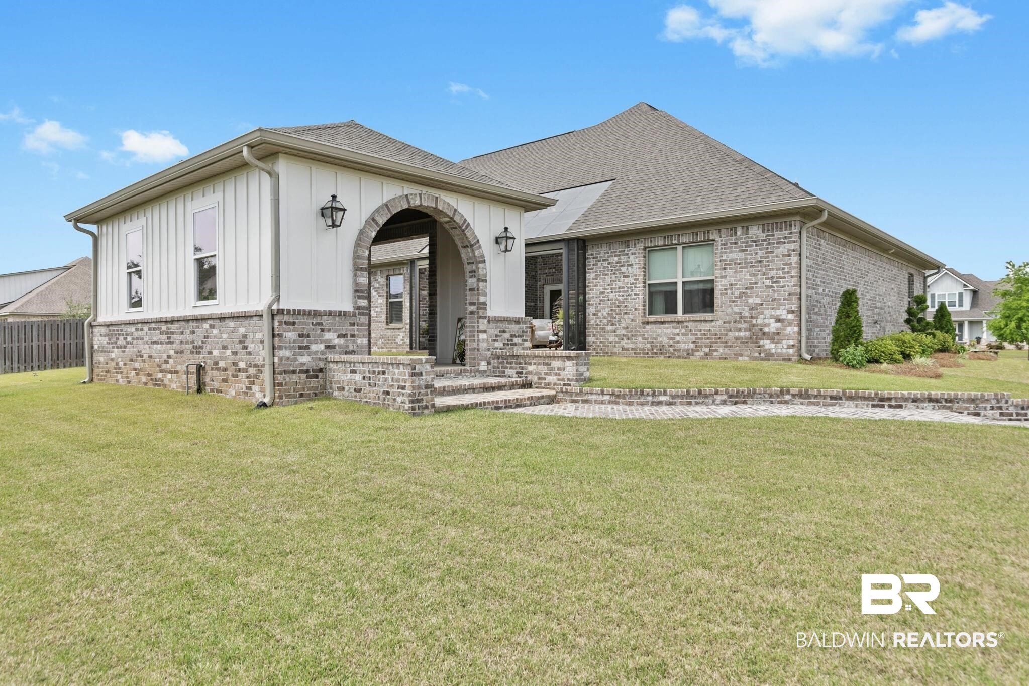 291 Hemlock Drive Fairhope, AL 36532 - Photo 58 of 65 View of front of property featuring brick siding, a front yard, board and batten siding, and roof with shingles