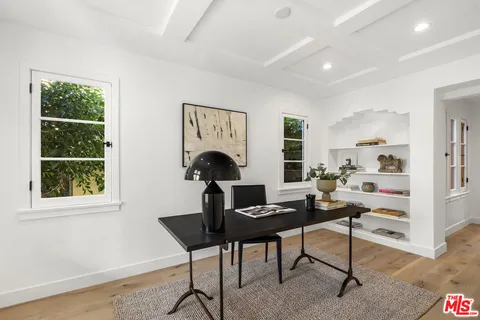 a workspace with furniture and a window