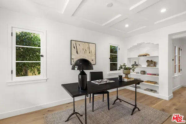 a workspace with furniture and a window