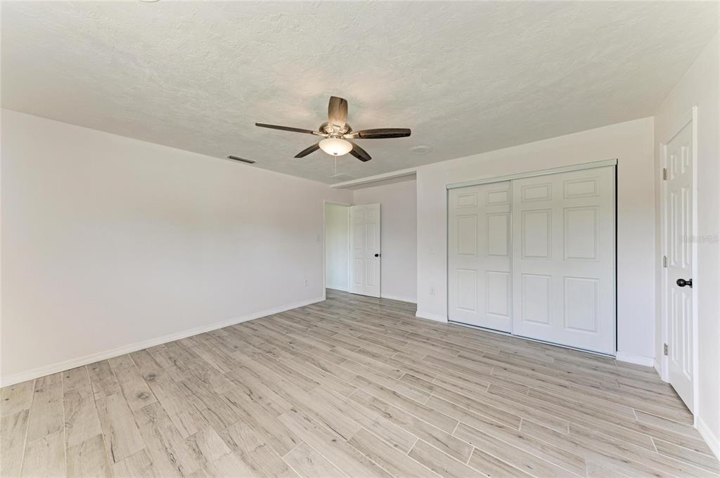 2544 Orsova Way Sarasota, FL 34231 - Photo 23 of 39 wooden floor in an empty room