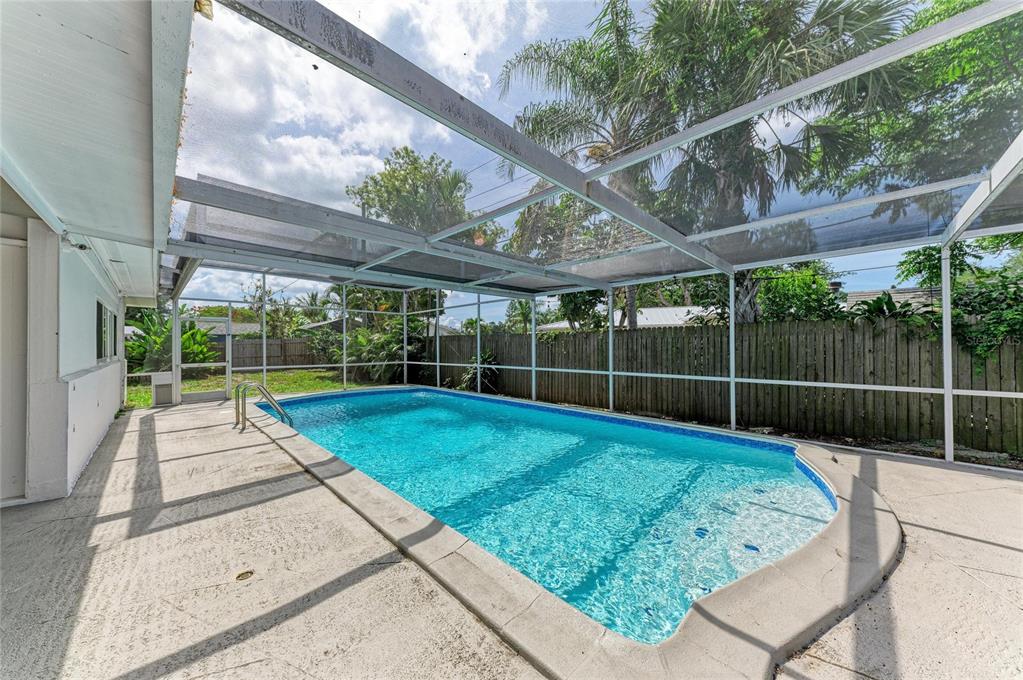 2544 Orsova Way Sarasota, FL 34231 - Photo 34 of 39 a view of a backyard with a swimming pool