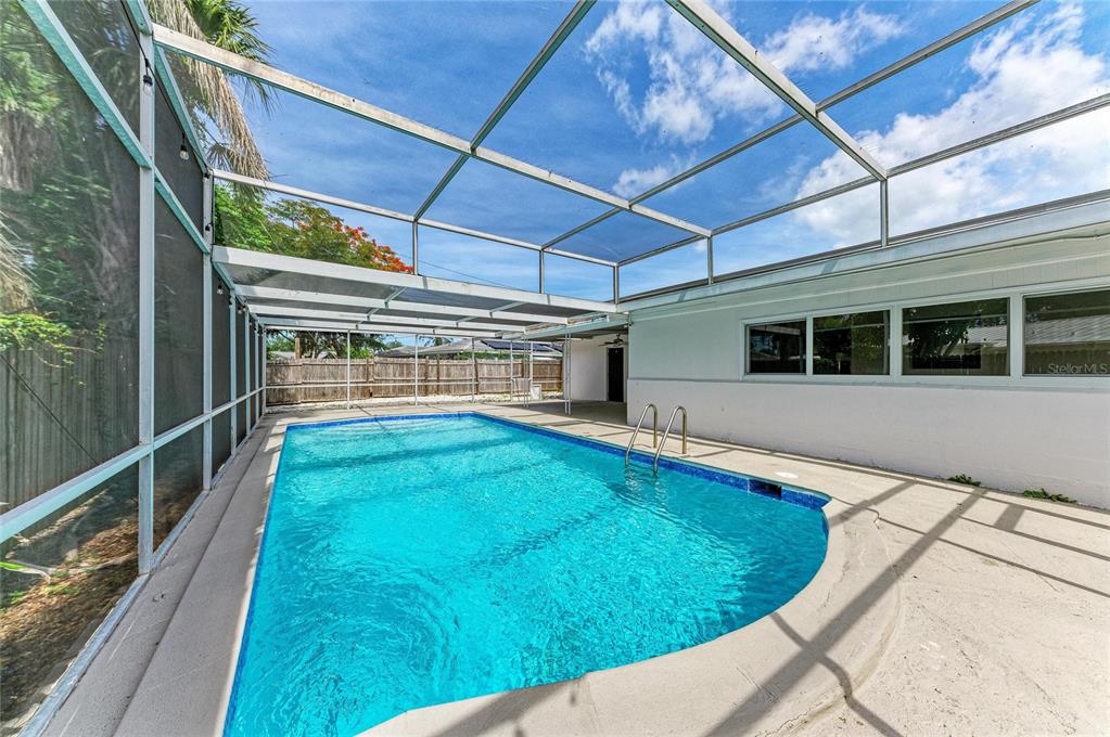 2544 Orsova Way Sarasota, FL 34231 - Photo 36 of 39 a view of a backyard with a swimming pool