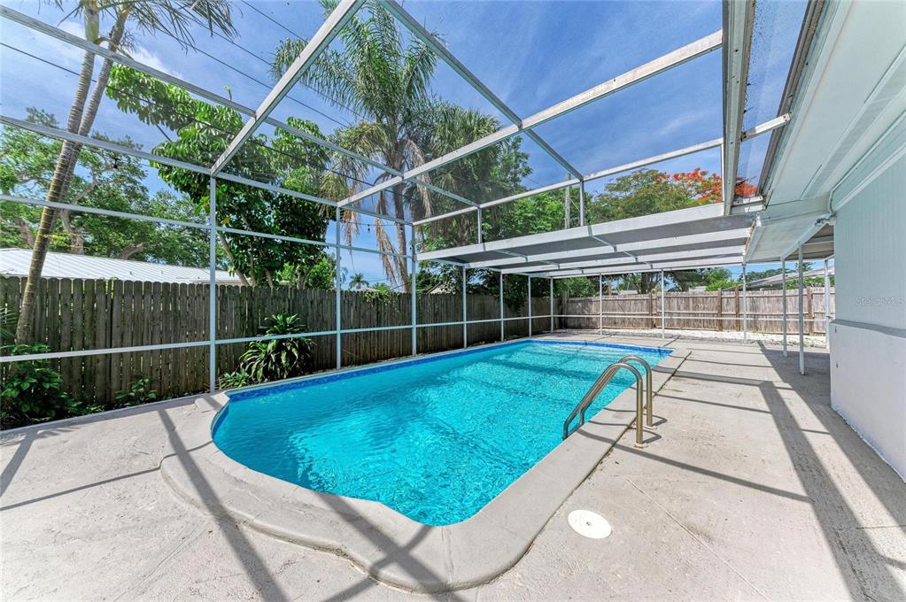 2544 Orsova Way Sarasota, FL 34231 - Photo 37 of 39 a view of a backyard with a swimming pool