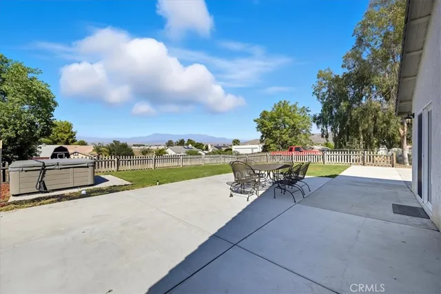 a view of an empty room with a fan