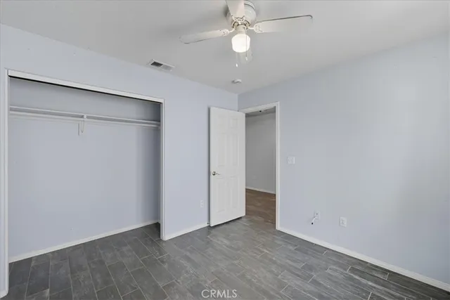 a view of a patio with a table and chairs