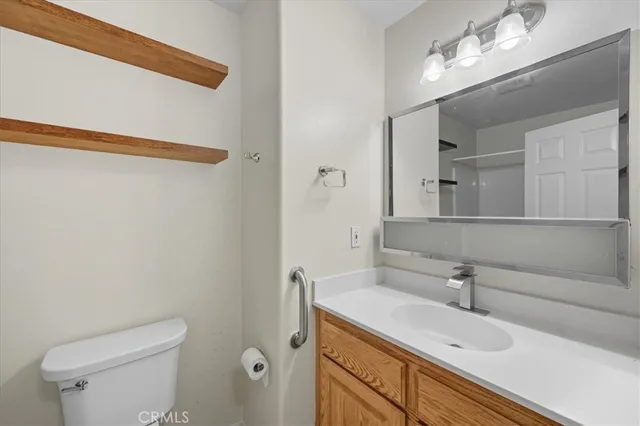 a kitchen with a stove sink and cabinets