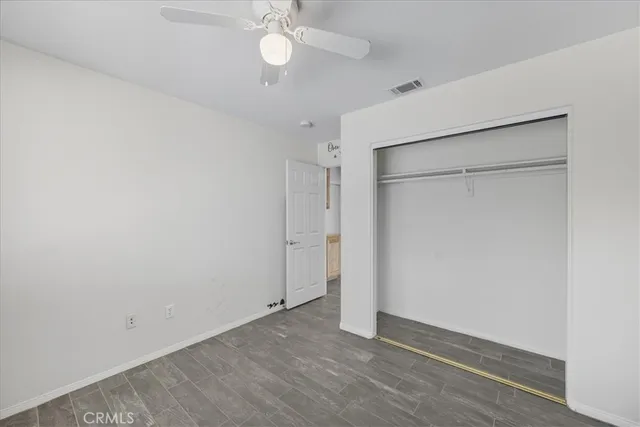 a view of a kitchen with a sink and a refrigerator