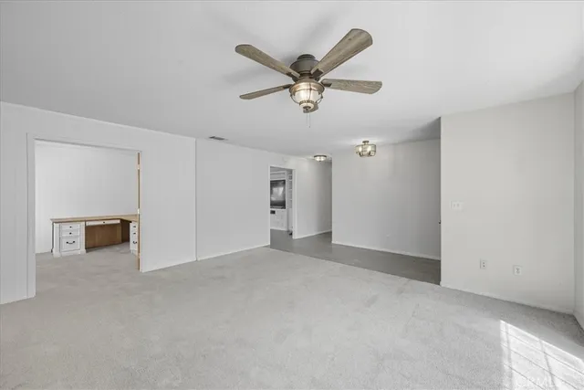 a view of a livingroom with a ceiling fan