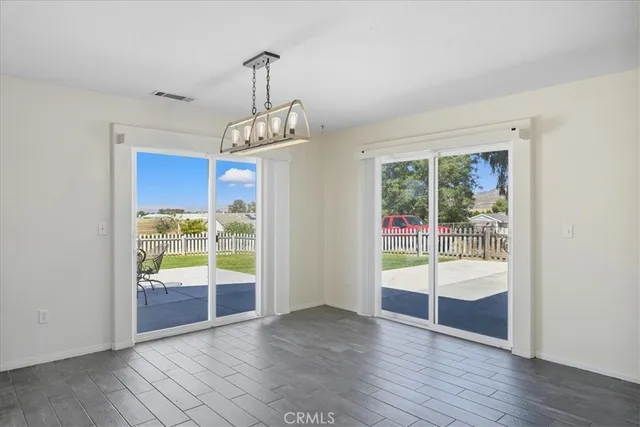 a view of an entryway with wooden floor and windows