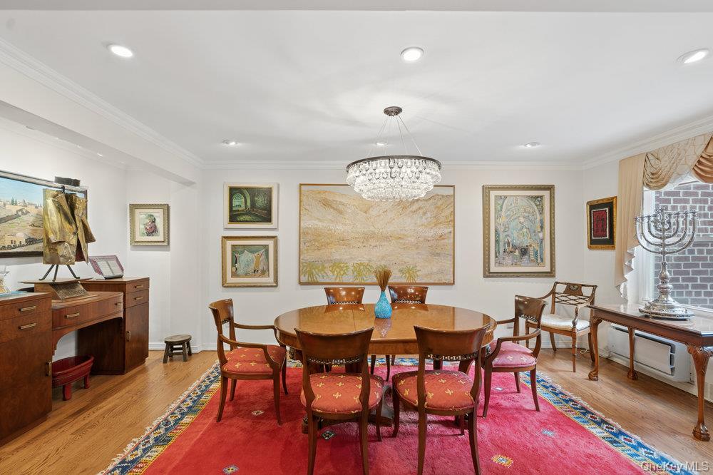 30 Stoner Avenue, Unit 1S Great Neck, NY 11021 - Photo 12 of 29 a view of a dining room with furniture a rug and wooden floor