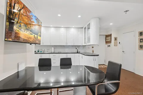 a kitchen with stainless steel appliances granite countertop a sink and a stove