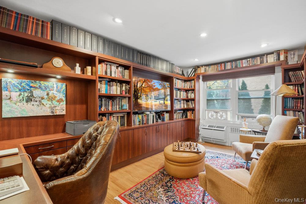 30 Stoner Avenue, Unit 1S Great Neck, NY 11021 - Photo 24 of 29 a living room with furniture and a large window