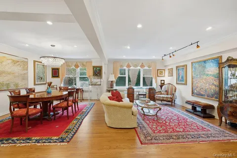 a living room with furniture rug and a large window