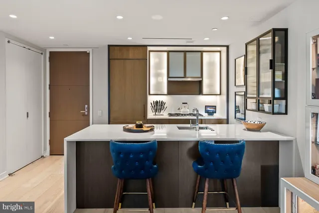 a kitchen that has a sink and a stove