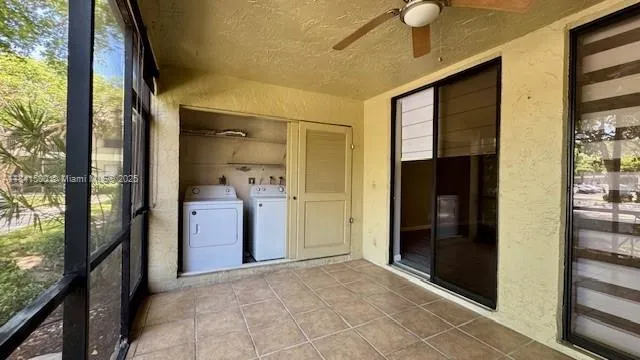 a view of a hallway with wooden shelves and a outdoor space