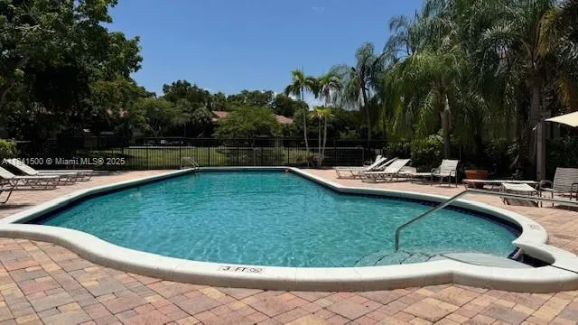 a view of a swimming pool with a patio