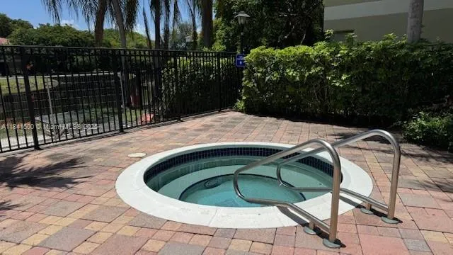 a view of a swimming pool with a patio