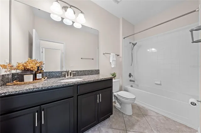 an aerial view of residential houses with yard