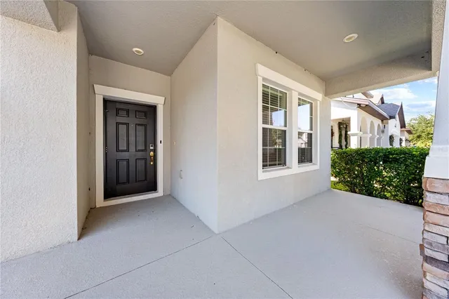 a kitchen with stainless steel appliances granite countertop a sink a stove and a wooden floors