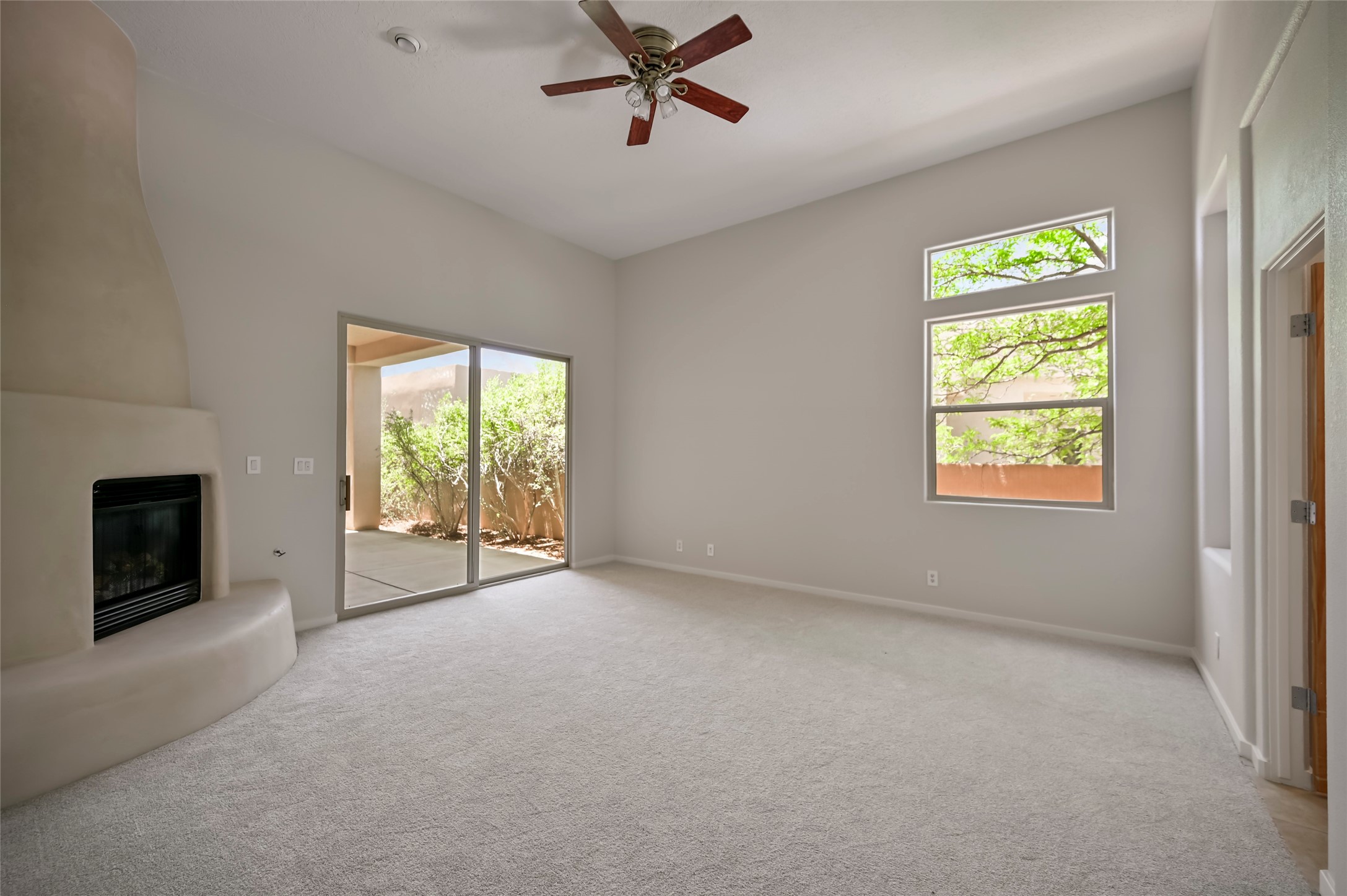 92 Canada Del Rancho Santa Fe, NM 87508 - Photo 24 of 52 Primary suite includes fireplace and opens to the patio