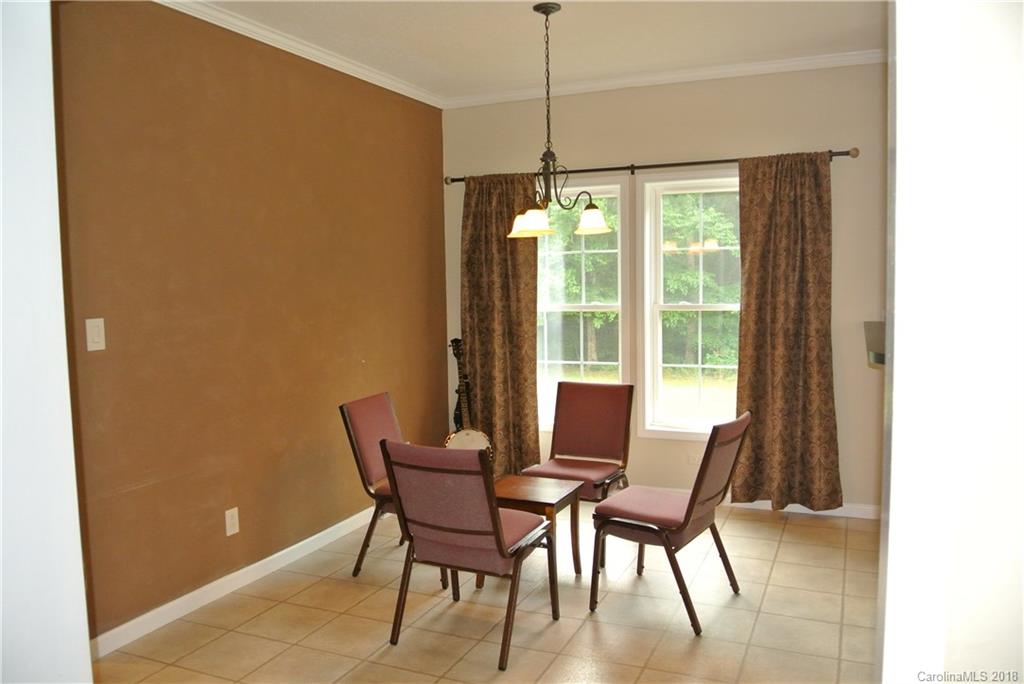 454 Gilmer Edwards Road Rutherfordton, NC 28139 - Photo 8 of 21 a view of a dining room with furniture and a window