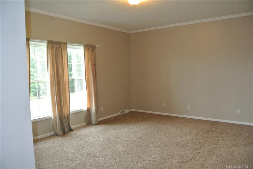 454 Gilmer Edwards Road Rutherfordton, NC 28139 - Photo 9 of 21 an empty room with windows