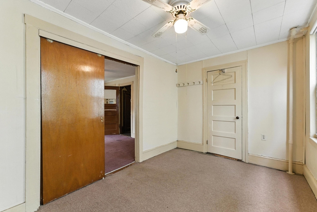 112 Grape Street Chicopee, MA 01013 - Photo 12 of 42 an empty room with windows and closet area