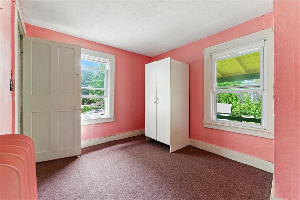 112 Grape Street Chicopee, MA 01013 - Photo 36 of 42 an empty room with windows and closet
