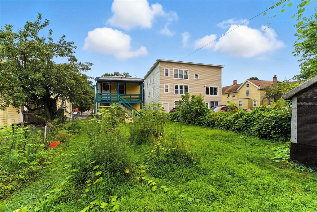 112 Grape Street Chicopee, MA 01013 - Photo 41 of 42 a view of a house with a yard and garden