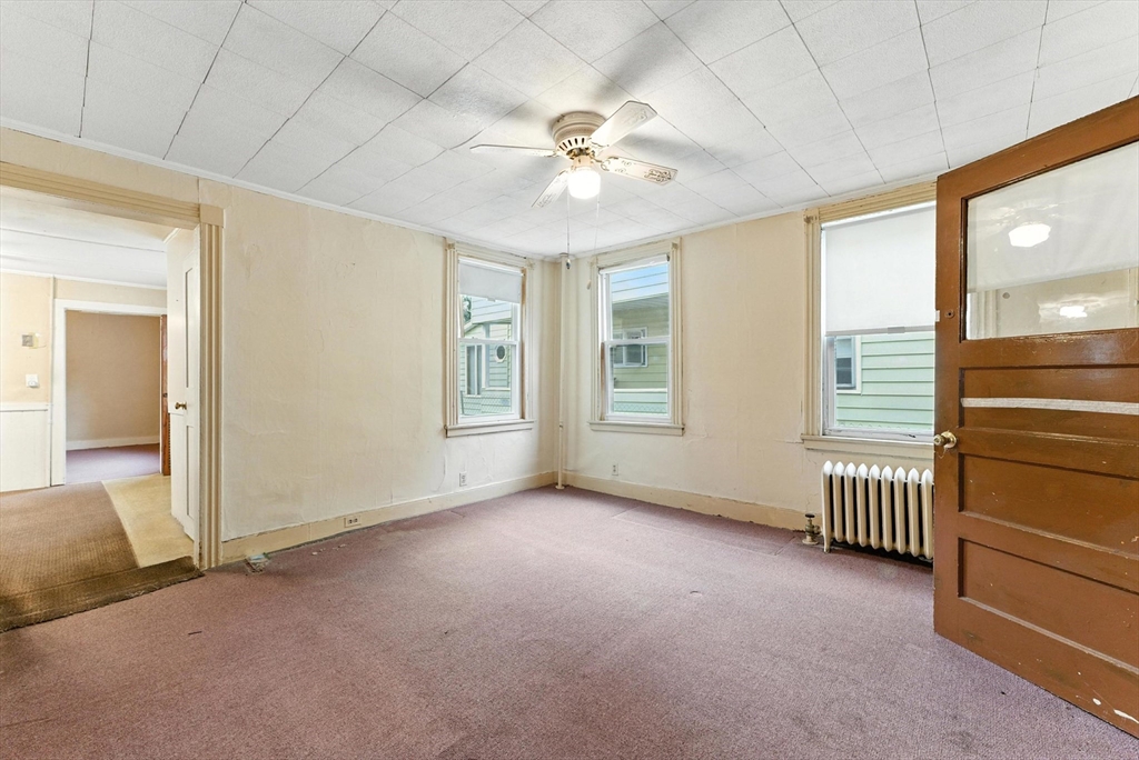 112 Grape Street Chicopee, MA 01013 - Photo 7 of 42 an empty room with windows and closet