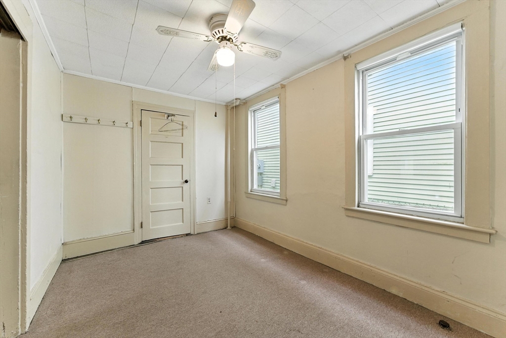 112 Grape Street Chicopee, MA 01013 - Photo 10 of 42 a view of an empty room with a window