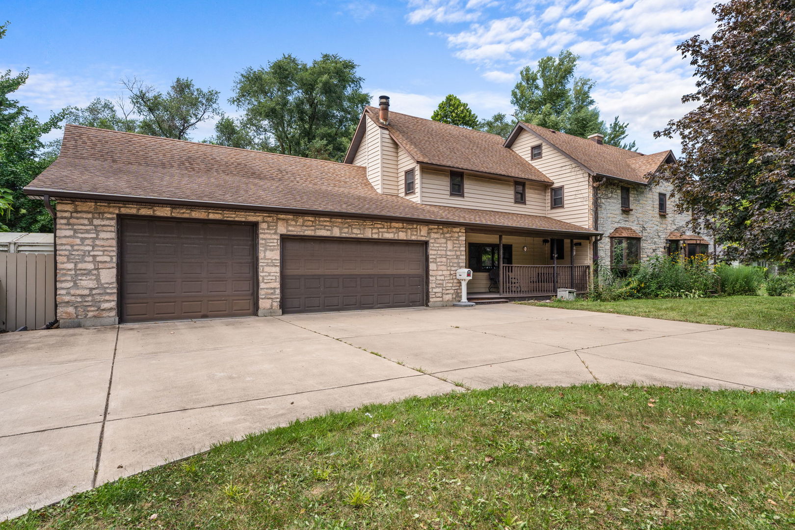 5N452 Central Road Itasca, IL 60143 - Photo 1 of 39 a front view of a house with a yard and garage