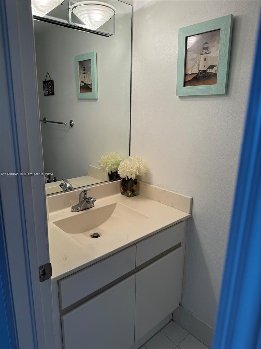 Sunset Harbour Miami Beach, FL 33139 - Photo 11 of 47 a bathroom with a sink and a mirror
