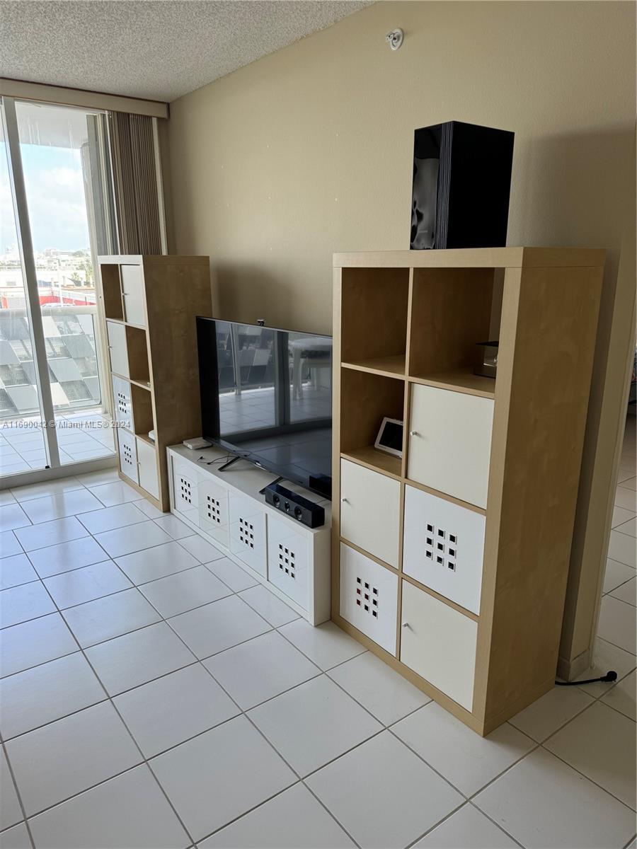 Sunset Harbour Miami Beach, FL 33139 - Photo 17 of 47 a kitchen with stainless steel appliances a stove a microwave and a counter top space